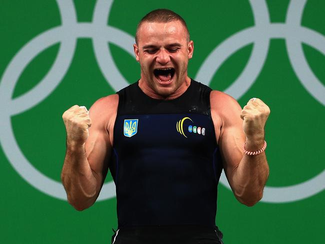 RIO DE JANEIRO, BRAZIL - AUGUST 12: Oleksandr Pielieshenko of Ukraine reacts during the Weightlifting - Men's 85kg on Day 7 of the Rio 2016 Olympic Games at Riocentro - Pavilion 2 on August 12, 2016 in Rio de Janeiro, Brazil. (Photo by Mike Ehrmann/Getty Images)