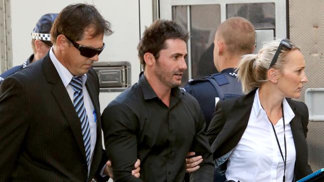 Daniel Heazlewood being arrested for the murder of his mother Linda Sidon. Picture Mike Batterham.