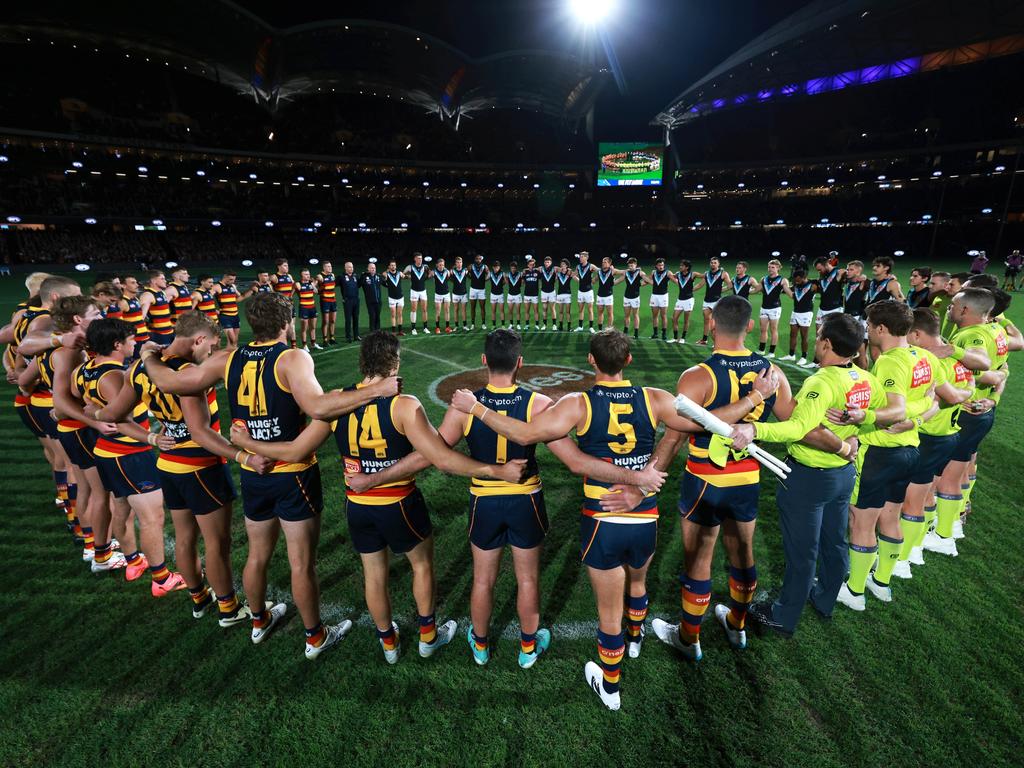 A moment of silence for gender-based violence during the 2024 AFL Round 8 match between the Adelaide Crows and the Port Adelaide Power. Picture: James Elsby/AFL Photos via Getty Images