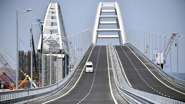 A vehicle runs down the 19 km road-and-rail Crimean Bridge passing over the Kerch Strait in 2018. Picture: AFP