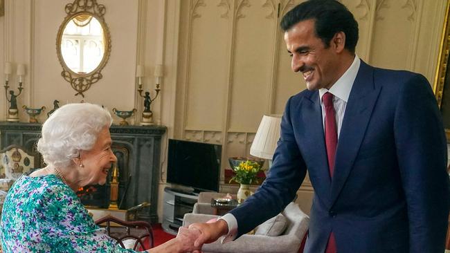 Queen Elizabeth II stands unaided to shake hands with the Emir of Qatar Sheikh Tamim bin Hamad al-Thani at Windsor Castle. Picture: AFP