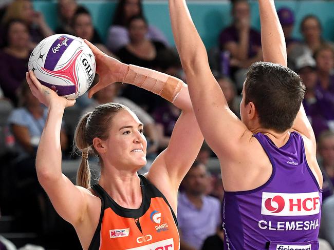 BRISBANE, AUSTRALIA - MAY 19: Caitlin Bassett of the Giants looks to pass during the round 4 Super Netball match between the Firebirds and Giants at Brisbane Arena on May 19, 2019 in Brisbane, Australia. (Photo by Bradley Kanaris/Getty Images)