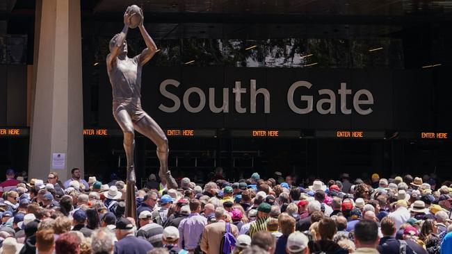 A cricket crowd waits to enter Adelaide Oval.