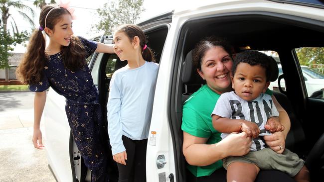 Mum Nadia Jean, pictured with her 18-month-old son Zander and nieces Ariel. 10 and Abbey Qasabian, 7, spends roughly three hours a day driving her kids and nieces around. Picture: Tim Hunter