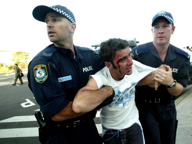 A man is arrested out the front of North Cronulla Surf club.