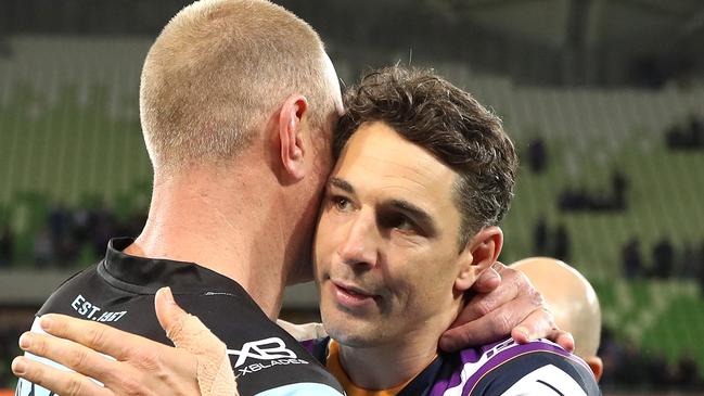 Billy Slater gets a hug from Luke Lewis at the end of Friday’s match. Picture: Getty.