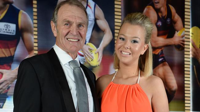 Amy Cornes — pictured with her football legend father Graham last year — is one of the Adelaide women whose images have been exploited on the sleazy website. She has spoken out about the invasion of her privacy. Picture: David Cronin