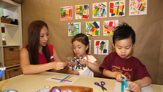 Lansvale Public School Preschool teacher Lien Chai with Serena Quach, 4, and Caden Le, 4. Picture: Robert Pozo