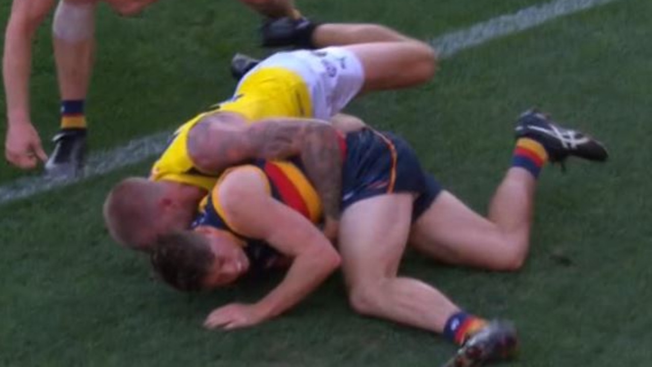 Patrick Parnell’s head cannons into the turf after a sling tackle from Richmond’s Nathan Board. Picrure: Fox Footy