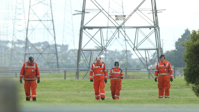 Corio SES volunteers scour the area after the shooting. Picture: Alan Barber