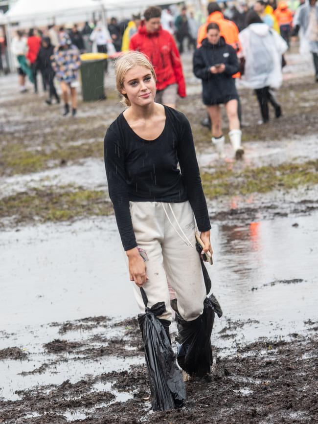 Hannah Patterson seen in the mud on day one of the festival. Picture: Marc Grimwade