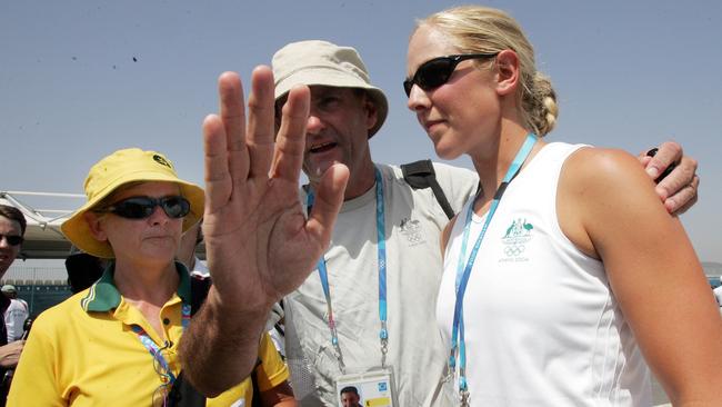 Michael Wilson from the AOC with Aust rower Sally Robbins and her mother after collapsing while competing in womens eight final at 2004 Athens Olympic Games 22 Aug 2004.