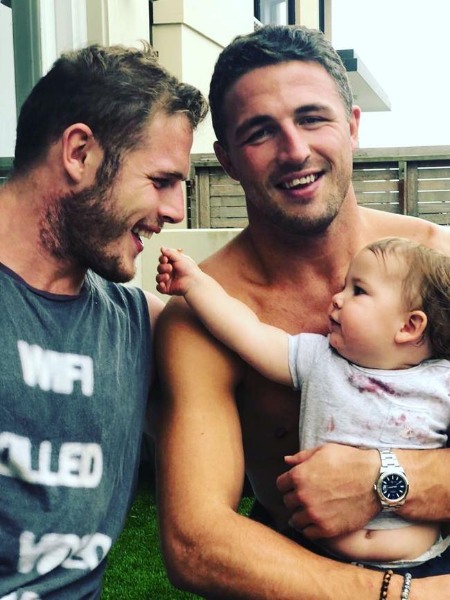 Burgess with his brother Thomas and son Billy.