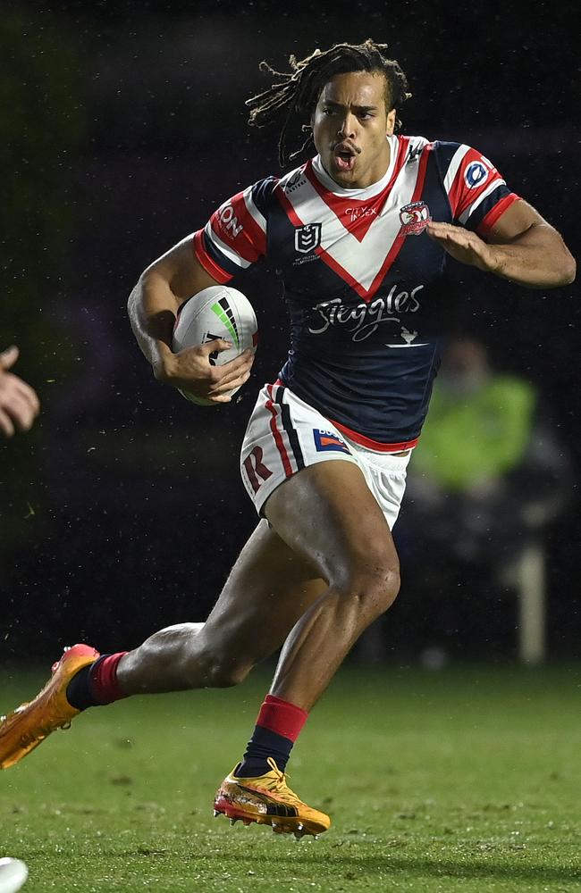 Dom Young on the attack for the Roosters.