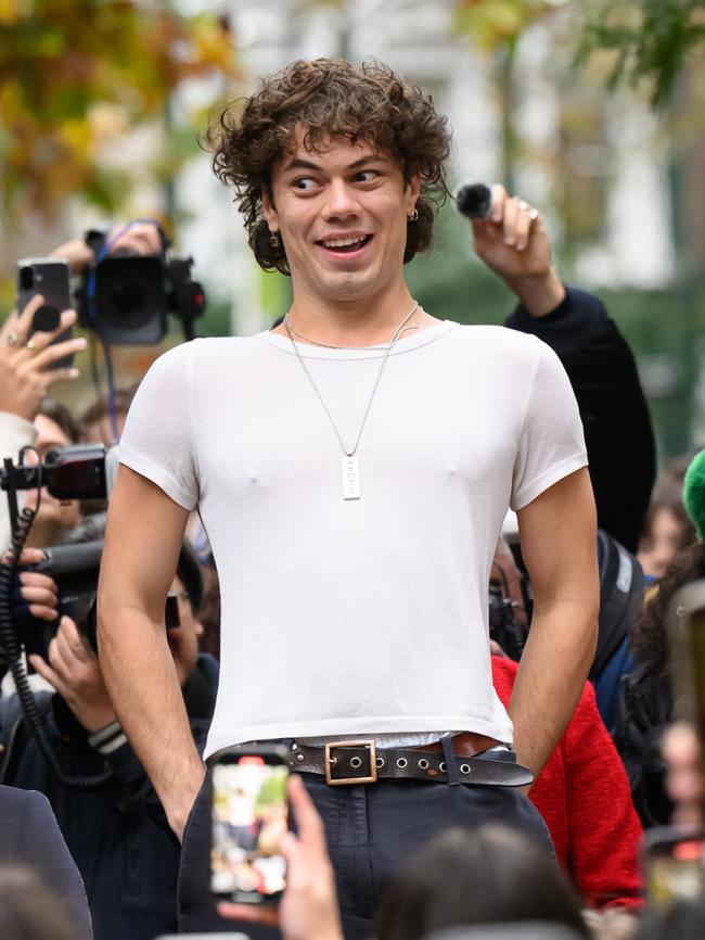 Oscar, the winning contestant in a Harry Styles lookalike competition, is cheered by fans of the former One Direction singer. Picture: Leon Neal/Getty Images