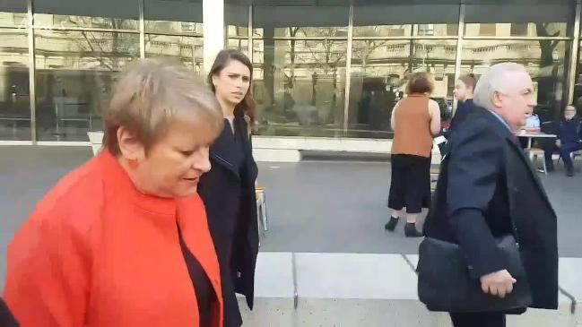 Teacher Kathryn Woods outside court