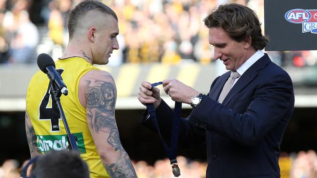 James Hird presents Dustin Martin with the North Smith Medal last year. Picture: Michael Klein