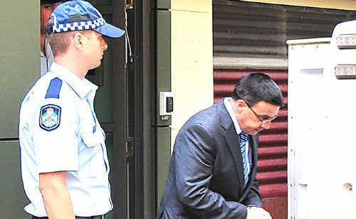 LIFE SENTENCE: Richard Giardina is led from the Maryborough courthouse yesterday. Photo: Nat Bromhead / Fraser Coast Chronicle. Picture: Nat Bromhead Ma