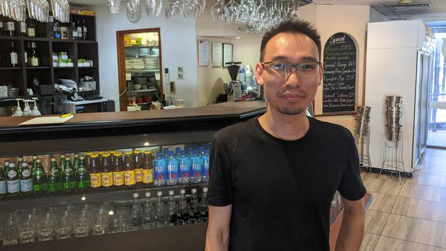 Cafe Les Amoureux owner Kiat Win said his bookings have evaporated this week after news a confirmed COVID case dined at Market Square Sunnybank. Picture: Alex Treacy