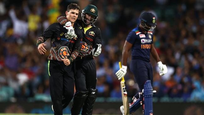 Mitchell Swepson, left, celebrates with Matthew Wade after taking the wicket of Sanju Samson. Picture: Getty Images