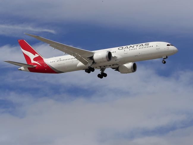 SYDNEY, AUSTRALIA - MARCH 10: A Qantas Airways jet lands at Sydney Airport on March 10, 2020 in Sydney, Australia. Qantas has cut almost a quarter of its international capacity for the next six months as travel demands fall due to fears over COVID-19. The airline today announced it was altering routes to London and would be parking eight of their 12 A380 aircraft. (Photo by Mark Evans/Getty Images)