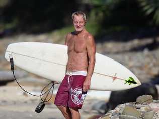 Laurie Towner is given a hug by a well-wisher at the paddleout to honour David "Baddy" Treloar. Picture: Contributed