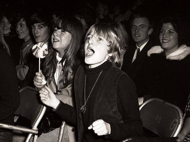 Fans watch The Beatles at Festival Hall.