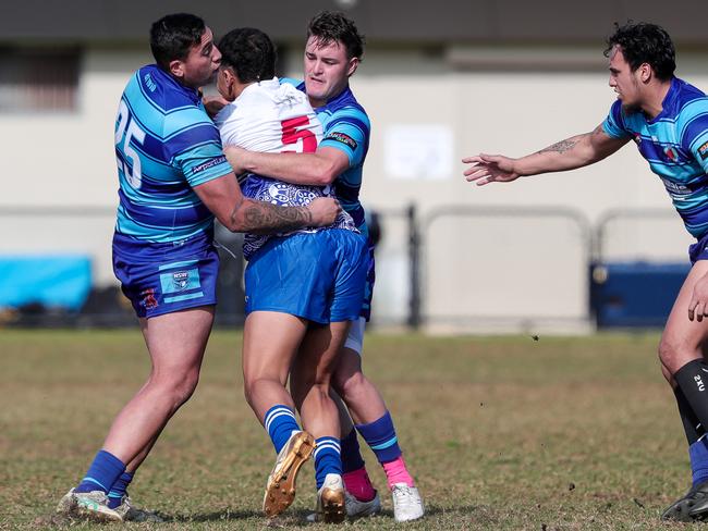 Percy Edwards wrapped up by Mascot's Tamati Leach and Cooper McGrath. Picture: Adam Wrightson Photography