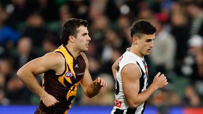 Finn Maginness tracks Nick Daicos during Hawthorn’s upset win. Picture: Dylan Burns/AFL Photos via Getty Images.