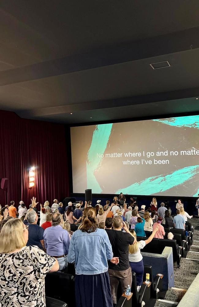 Churchgoers at a service at the temporary location at the cinemas.