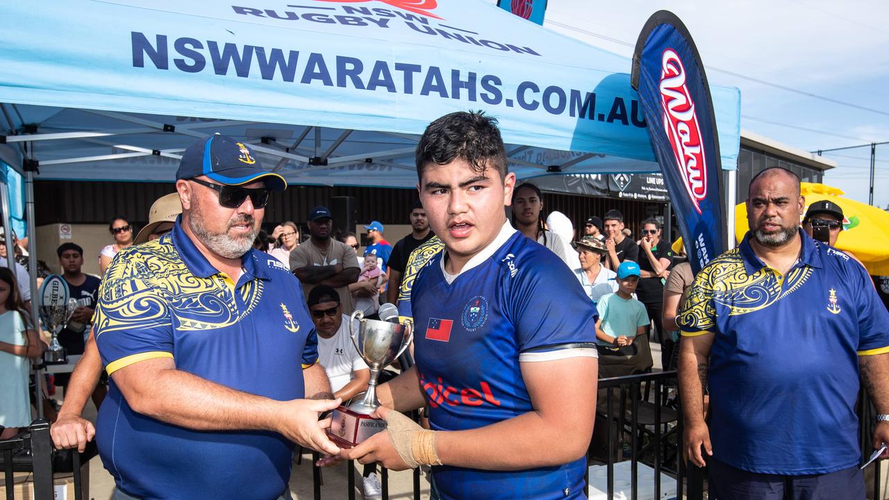 The trophy being awarded after the final of the 14s tournament between NSW Maori and Samoa.