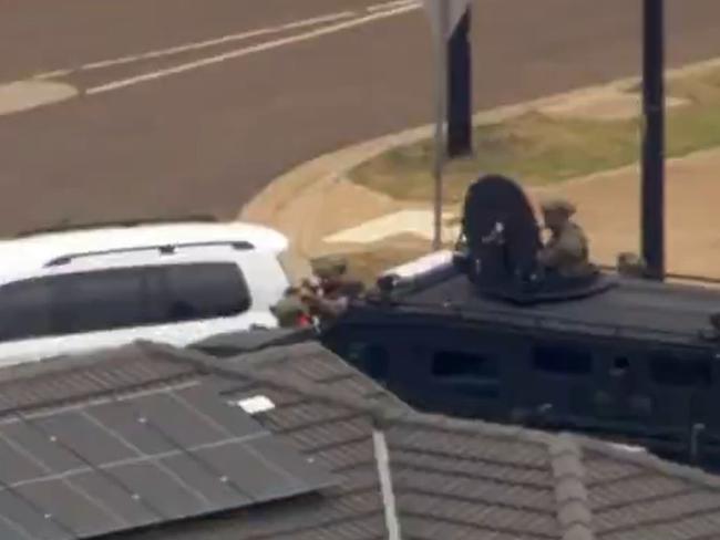 Armed police at the scene. Picture: 7News