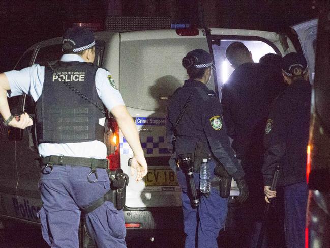 Police arrest a teen on the street next to Camperdown park in Newtown, There looked to be a large number of teens drinking in Camperdown park and Camperdown Cemetery. 17th July, 2020. Picture by Damian Shaw