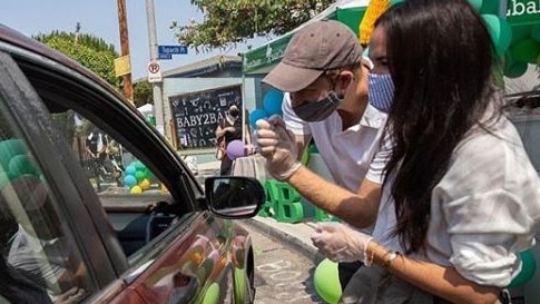 Meghan Markle and Prince Harry are photographed as they volunteer at a school charity drive in Los Angeles. Picture: Instagram