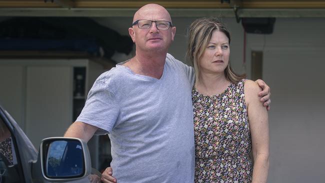 Guy and Nadine Broadbent in front of their garage where their car was stolen and declared uninsured due to a loophole in the policy. Picture: Glenn Campbell