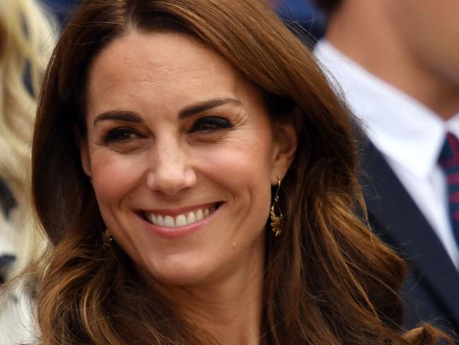 Britain's Catherine, Duchess of Cambridge smiles on Centre Court watching Germany's Tatjana Maria playing against Germany's Angelique Kerber at The All England Tennis Club in Wimbledon, southwest London, on July 2, 2019, on the second day of the 2019 Wimbledon Championships tennis tournament. (Photo by GLYN KIRK / AFP) / RESTRICTED TO EDITORIAL USE