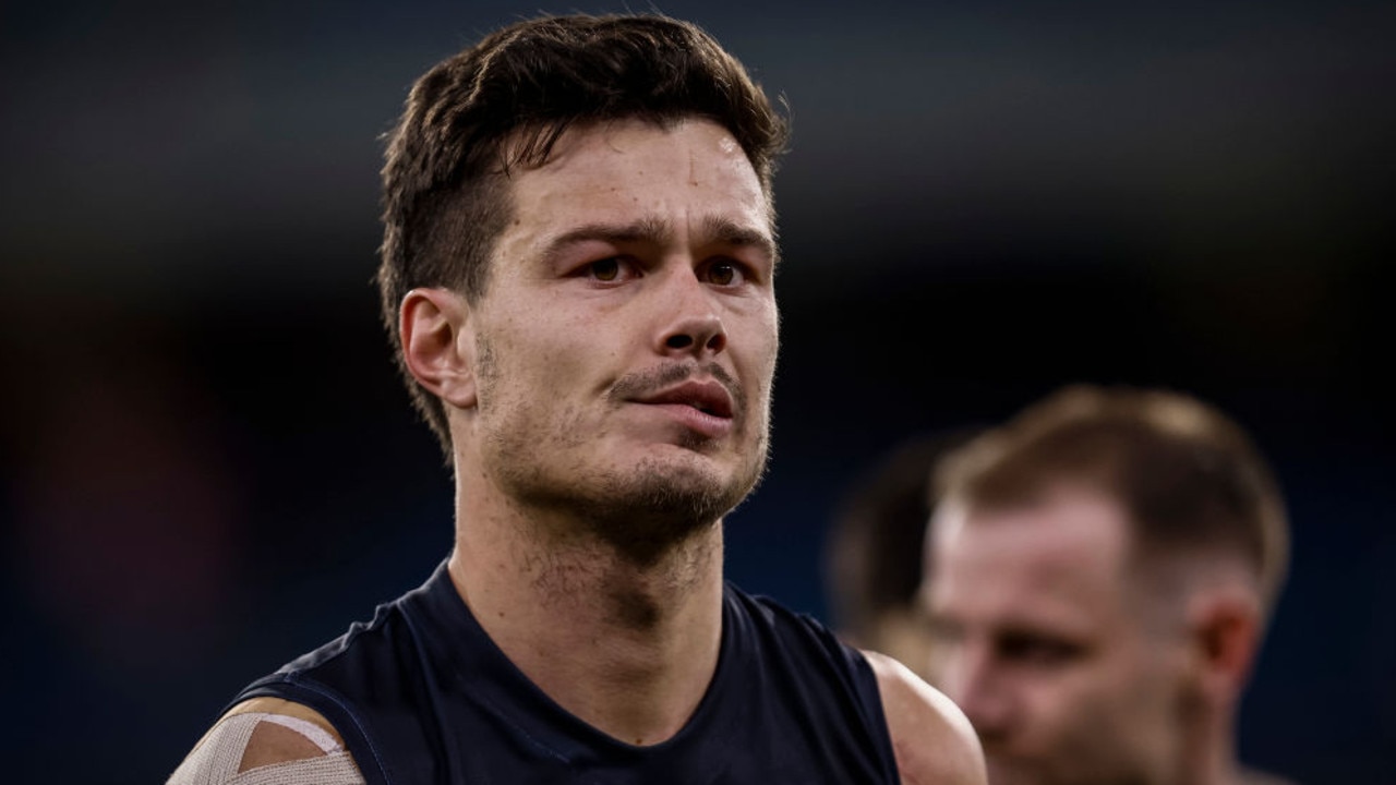 MELBOURNE, AUSTRALIA - JULY 16: A dejected Jack Silvagni of the Blues walks from the ground after the round 18 AFL match between the Carlton Blues and the Geelong Cats at Melbourne Cricket Ground on July 16, 2022 in Melbourne, Australia. (Photo by Darrian Traynor/Getty Images)