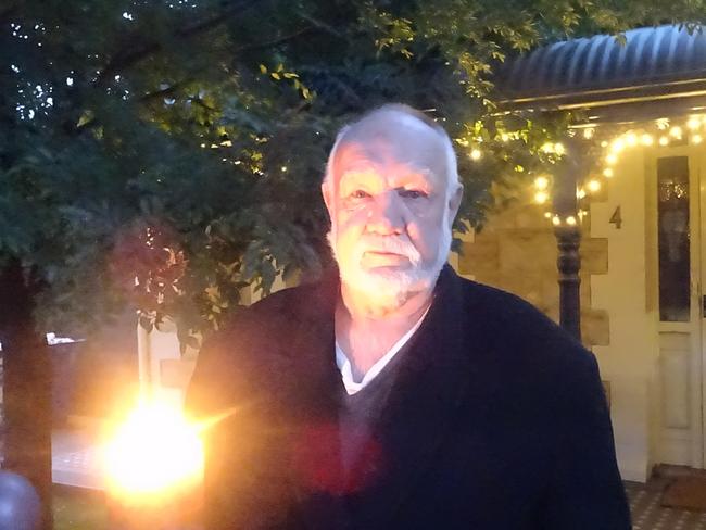 Millswood man Jim Rumbelow, 71 lights a candle for his dad Geoff, a Rat of Tobruk. Photo Paul Starick.