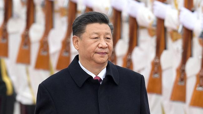 Chinese President Xi Jinping walking past a military honour guard during a visit by the French president outside the Great Hall of the People in Beijing. Picture: Nicolas Asfouri / AFP)