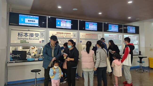 Parents and children wait at a medical facility in China. Picture: Twitter.