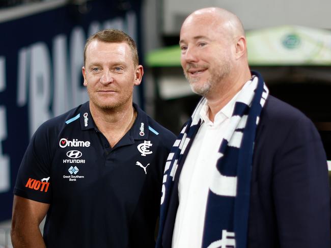 MELBOURNE, AUSTRALIA - MARCH 14: Michael Voss, Senior Coach of the Blues and President Luke Sayers celebrate during the 2024 AFL Round 01 match between the Carlton Blues and the Richmond Tigers at the Melbourne Cricket Ground on March 14, 2024 in Melbourne, Australia. (Photo by Michael Willson/AFL Photos via Getty Images)