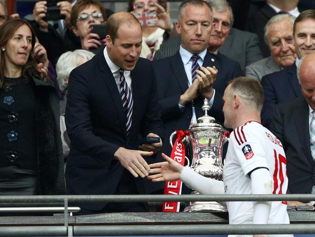 Prince William congratulates winning captain Wayne Rooney of Manchester United after FA Cup Final against Crystal Palace at Wembley Stadium last year. Picture: Getty