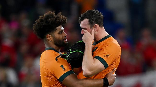 LYON, FRANCE - SEPTEMBER 24: Rob Valetini consoles Nick Frost of Australia at full-time following the Rugby World Cup France 2023 match between Wales and Australia at Parc Olympique on September 24, 2023 in Lyon, France. (Photo by Hannah Peters/Getty Images)