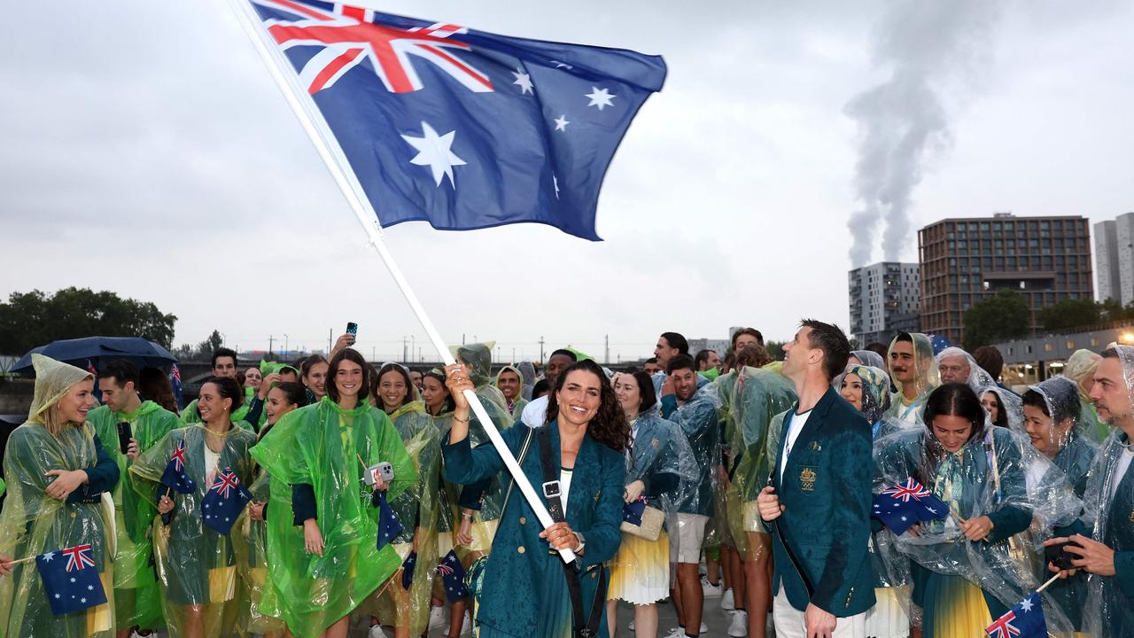 Jessica Fox, Flagbearer of Team Australia on the river. Photo by Quinn Rooney / POOL / AFP.