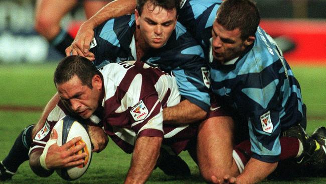 Owen Cunningham tackled by Noel Goldthorpe and Ian Roberts during Qld vs NSW Tri-Series final. Photo: Anthony/Weate