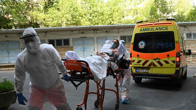 People participate in training for medical staff, police and military officials, in Budapest, Hungary, where the arrival of a tourist bus with coronavirus-infected travellers was simulated. Patients admitted to the ICU now have a much higher chance of surviving than those admitted early in the pandemic. “This undoubtedly is in part due to improved understanding of the disease and more bespoke treatment”, said Professor Tim Cook of Bristol University. Picture: AFP