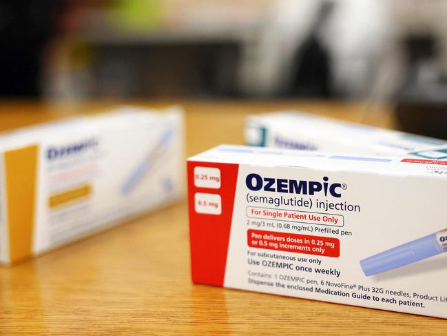 (FILES) This photo illustration shows boxes of the diabetes drug Ozempic resting on a pharmacy counter in Los Angeles, California, on April 17, 2023. Over 40 percent of Americans suffer from obesity, reflecting a major health crisis and the massive market for new Ozempic-type drugs. With their "groundbreaking" effectiveness, the drugs will be "the first line therapy for people who are obese," research physician Samuel Klein of Washington University in St. Louis told AFP. (Photo by MARIO TAMA / GETTY IMAGES NORTH AMERICA / AFP)