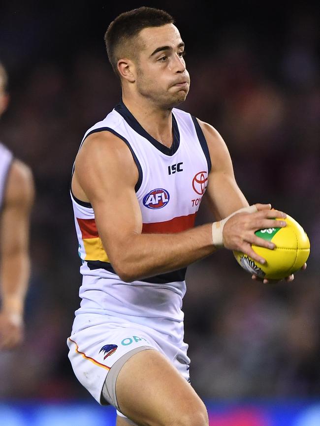 Myles Poholke playing for the Crows.