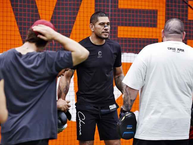 DAILY TELEGRAPH - 12.2.25UFC Light Heavyweight champion Alex Pereira (middle wearing black) visits GWS Giants HQ in Homebush today before leaving unexpectedly. Picture: Sam Ruttyn