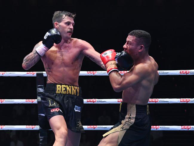 Ben Mahoney (left) strikes John Ruba during his The Worlds Collied undercard fight at the Brisbane Convention and Exhibition Centre in Brisbane, Saturday, November 30, 2019. (AAP Image/Dave Hunt)